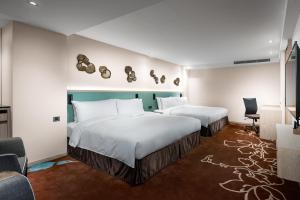 Postel nebo postele na pokoji v ubytování K Hotel Taipei II