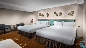 Postel nebo postele na pokoji v ubytování K Hotel Taipei II
