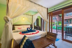 Postel nebo postele na pokoji v ubytování Koh Tao Beach Club