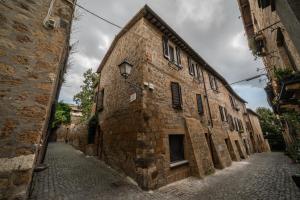 an old stone building on a cobblestone street at Home in Orvieto - Via dei Dolci in Orvieto