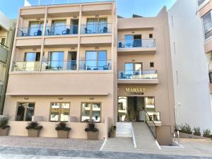 a building with the front entrance to the marriott hotel at Marvel Deluxe Rooms in Heraklio