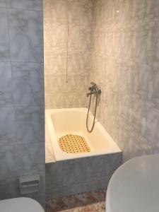 a bathroom with a shower with a toilet and a sink at Romantika in Platis Gialos