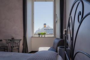 Postel nebo postele na pokoji v ubytování B&B Caterina