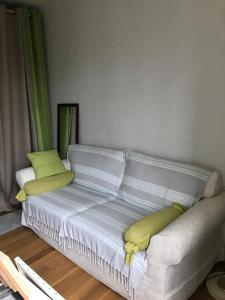 a bed with two pillows on it in a room at L'atelier de Jocelyne in Beuzeville