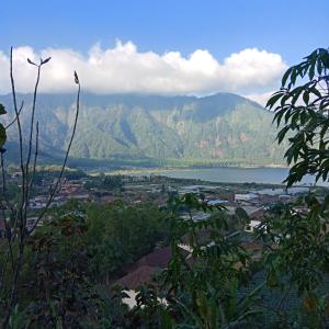 a view of a city and a body of water and mountains at ECO Bedugul adventurer camp in Bedugul +22 photos