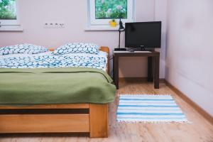 Posteľ alebo postele v izbe v ubytovaní Agroturystyka Pod Modrzewiami