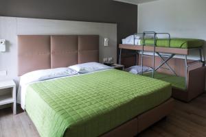 A bed or beds in a room at Albergo Ristorante Belvedere