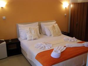 Postel nebo postele na pokoji v ubytování Hotel Wellness & Spa Angelo Gabriel