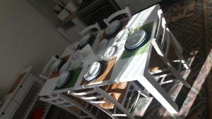a white table with white plates on it at Casa Vacanze La Villa in Morino
