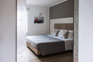 A bed or beds in a room at Albergo Ristorante Belvedere