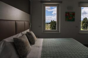 A bed or beds in a room at Albergo Ristorante Belvedere