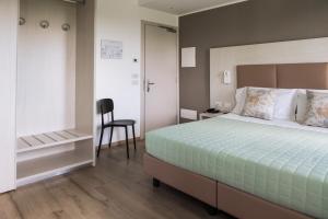 A bed or beds in a room at Albergo Ristorante Belvedere