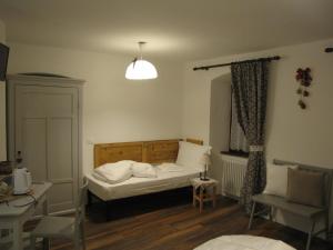 A bed or beds in a room at La Molinela B&B
