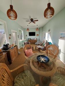 a living room with a table and chairs at Island View Cottages Sebastian in Sebastian