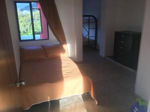 Postel nebo postele na pokoji v ubytování APARTAHOTEL TAYAMBE