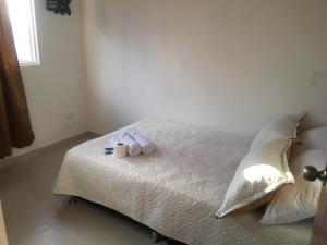 Postel nebo postele na pokoji v ubytování APARTAHOTEL TAYAMBE