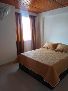 Postel nebo postele na pokoji v ubytování APARTAHOTEL TAYAMBE