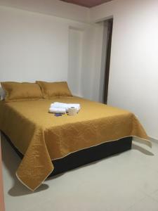 Postel nebo postele na pokoji v ubytování APARTAHOTEL TAYAMBE