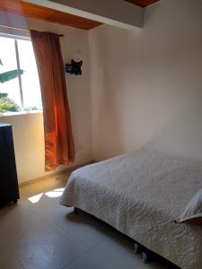 Postel nebo postele na pokoji v ubytování APARTAHOTEL TAYAMBE