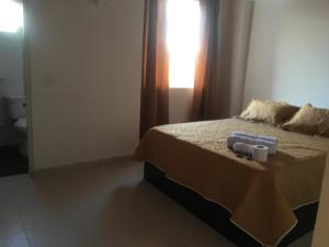 Postel nebo postele na pokoji v ubytování APARTAHOTEL TAYAMBE
