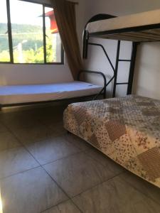 Postel nebo postele na pokoji v ubytování APARTAHOTEL TAYAMBE