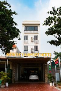 a hotel with a car parked in a garage at New Sky Airport Hotel in Noi Bai