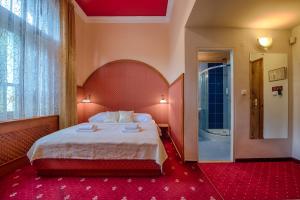 Postel nebo postele na pokoji v ubytování Hotel Zlatý Orel