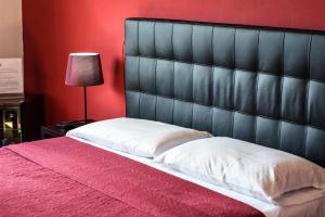 Postel nebo postele na pokoji v ubytování Hotel Kennedy