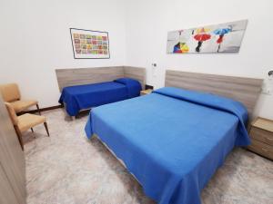 A bed or beds in a room at Mondello Vista Mare