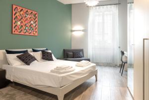 Postel nebo postele na pokoji v ubytování B&B Mazzini15