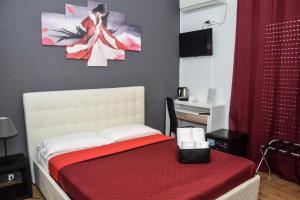 Postel nebo postele na pokoji v ubytování Hotel Kennedy