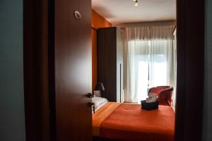 Postel nebo postele na pokoji v ubytování Hotel Kennedy