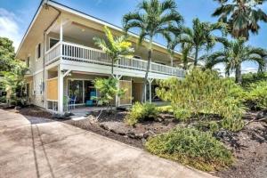 an exterior view of a house with palm trees at The cozy big studio -30 days in Kailua-Kona