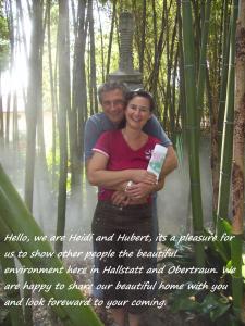 a man and a woman standing in a forest at Apartmenthaus Simmer in Obertraun