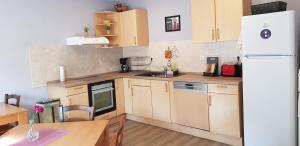 Virtuvė arba virtuvėlė apgyvendinimo įstaigoje Pension STELLA