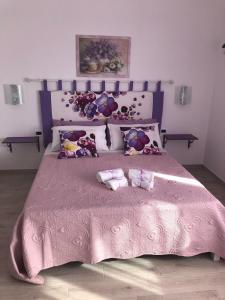 Postel nebo postele na pokoji v ubytování Casa Violet per Civita