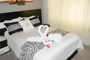 Postel nebo postele na pokoji v ubytování Hotel Tababela Land