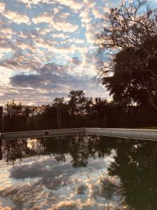 a reflection of the sky in a pool of water at Piracuacito in Paso de la Patria