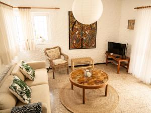 a living room with a couch and a coffee table at Monte Rojo in Corralejo