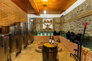 a wine cellar with a bunch of bottles of wine at Guest House Gardenia & Wine Cellar in Lagodekhi
