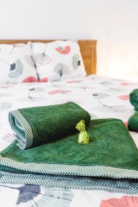 Posteľ alebo postele v izbe v ubytovaní Grand Apartament