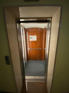 a elevator in a room with a wall at Sea view apartment Jadranka in Portorož