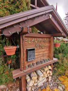 a woodburning stove in a garden with a roof at GARDEN CHALET in Daugavpils