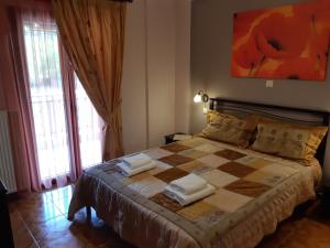 Ένα ή περισσότερα κρεβάτια σε δωμάτιο στο Ariadni