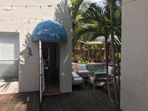 a patio with a table and a swimming pool at Little havana paradise in Miami