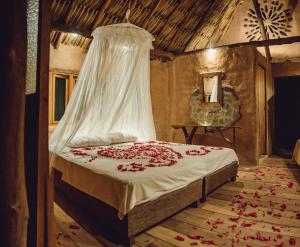 Postel nebo postele na pokoji v ubytování Ecolodge Cosmogénesis
