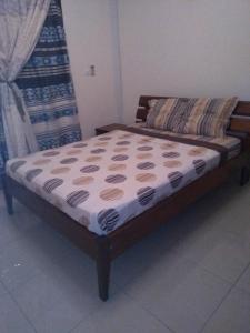 a bed sitting in a room with at Les pélerins in Pointe-Noire