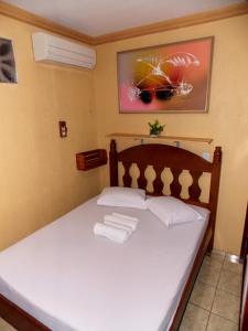 Ένα ή περισσότερα κρεβάτια σε δωμάτιο στο Léa Pousada
