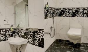 un bagno con lavandino e WC di Hotel Plaza Executive - near BKC a Mumbai