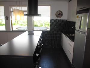 Kuchyň nebo kuchyňský kout v ubytování Ártún Apartment